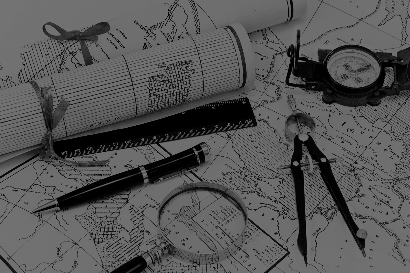 land surveyor mapping and planning tools in black and white