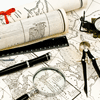 white map with black ink on desk with magnifying glass